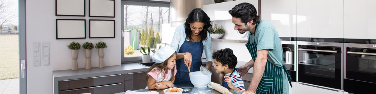 family cooking in modern kitchen
