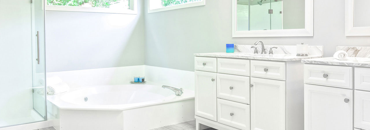 white bathroom tub and sink vanity