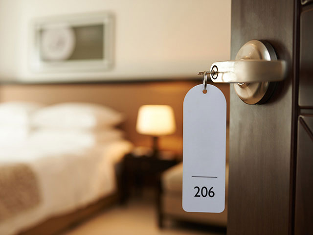 hotel room door with key